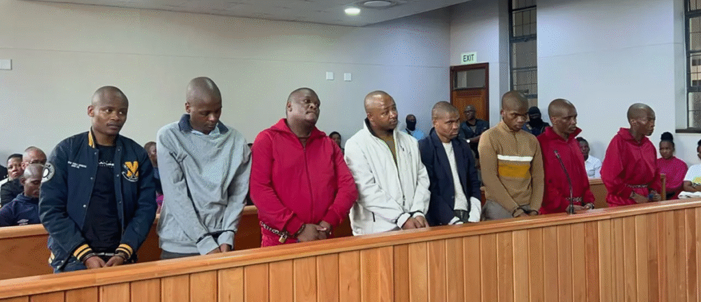 The accused men standing in the dock during the Lusikisiki mass murder trial at Lusikisiki Magistrates' Court