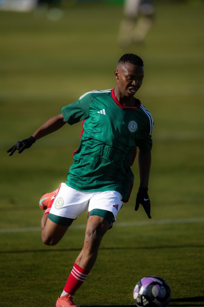 Mohau Nkota in action for Al-Ettifaq, dribbling the ball during a match against Portimonense