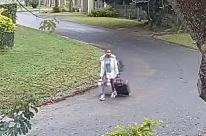 CCTV image of Mozambican domestic worker leaving employer’s property with two suitcases in Meerensee,