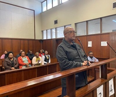 Principal Khayelihle Dhlomo appears in court facing charges of murdering his wife in 2022