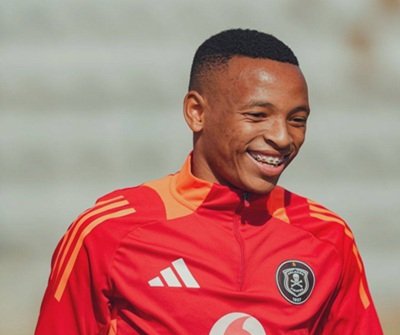 Relebohile Mofokeng wearing a red Orlando Pirates jersey, looking focused during a training session or warm-up
