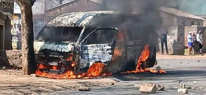 Burnt minibus taxi at Maponya Mall following violent clashes between drivers
