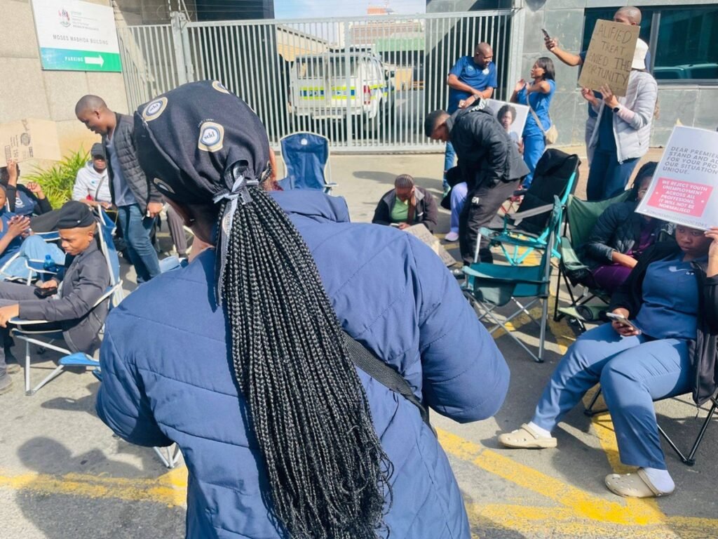 A group of unemployed doctors in KZN hold banners during a protest in August 2025, demanding government intervention and job placements.