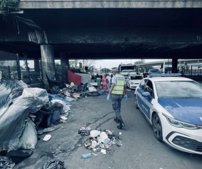 Metro police officers monitoring Che Guevara Road in Durban after a cleanup operation
