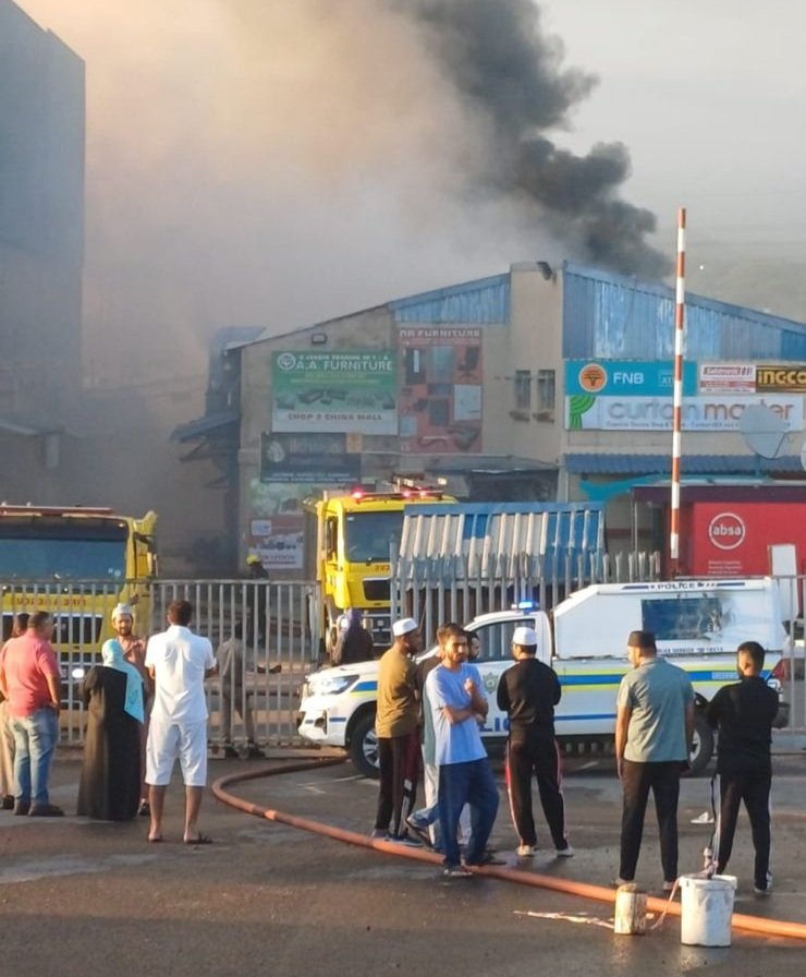 Firefighters and emergency vehicles responding to the Springfield China Mall fire in Durban