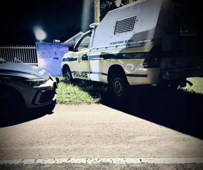 Police vehicles at the scene of a shootout in Pinetown where a suspected hitman was killed