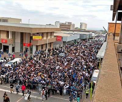 SAPS officers managing crowd during Middelburg protest in Mpumalanga after arresting 14 suspects